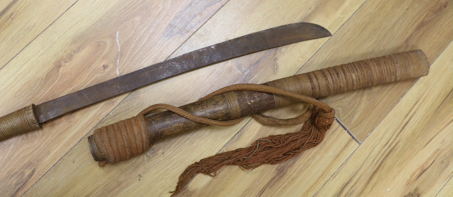 Two Burmese dha swords.